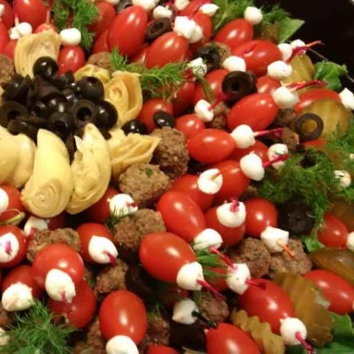 Appetizers with meatballs, cheese and tomatoes